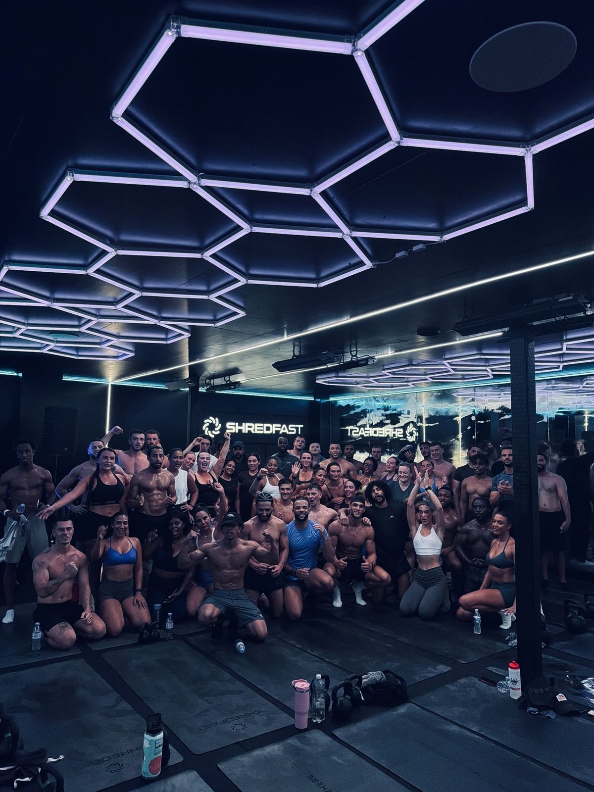 A full ShredFast Trafford class gathered on the training floor after a session